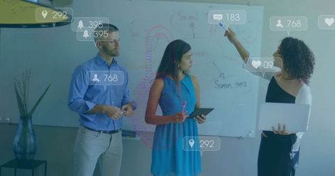 Colleagues engaging in social media data discussion at modern office