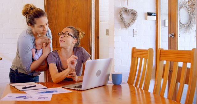 Female Couple Working Together with Baby at Home Office - Download Free Stock Images Pikwizard.com