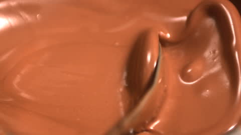 Luxurious Melted Chocolate Stirring in Slow Motion