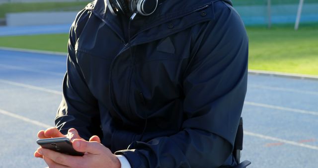 Person in Wheelchair Typing on Smartphone Outdoors - Download Free Stock Images Pikwizard.com