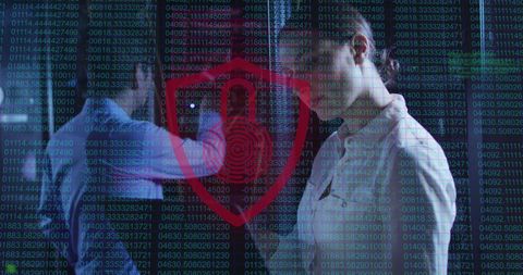 Cybersecurity Team Handling Sensitive Data in Server Room