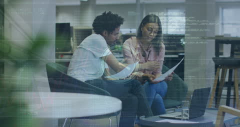 Diverse Business Team Analyzing Data with Digital Overlay