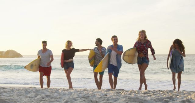 Group of Friends with Surfboards Enjoying Sunset on Beach - Download Free Stock Images Pikwizard.com