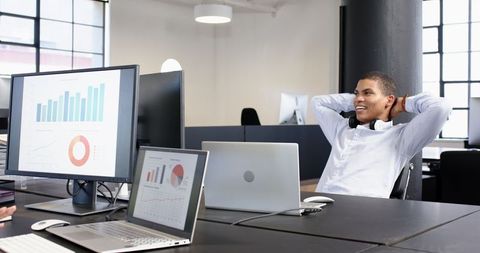 Confident business professional analyzing data in modern office