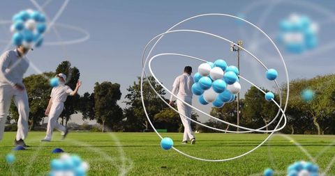 Floating atom model hovering above cricket players on sunlit practice field, hologram