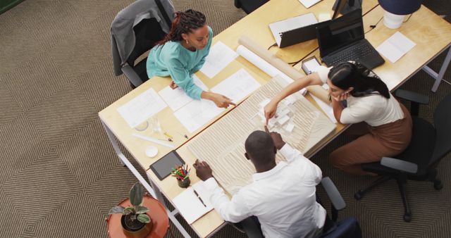 Diverse Team Collaborating on Architectural Project in Workspace - Download Free Stock Images Pikwizard.com