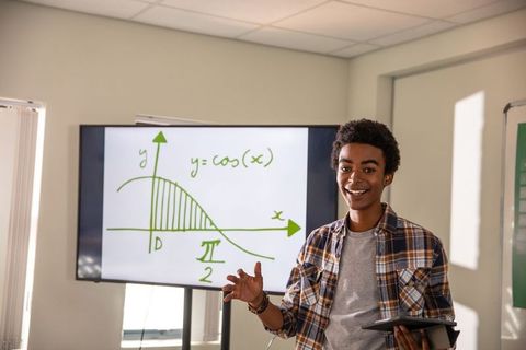 African american student presenting math lesson with tablet and cosine graph on screen