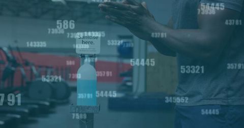 Man using hand sanitizer in gym during pandemic with fading numbers