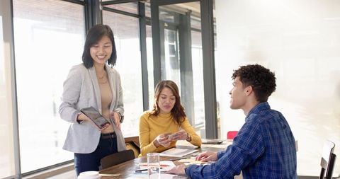 Diverse Team Collaborating with Technology and Creative Tools