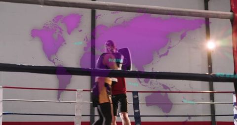 Boxer training with coach holding mitts in ring with purple world map overlay