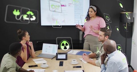 Female presenter using AR overlays to showcase CO2 data and sustainability in boardroom