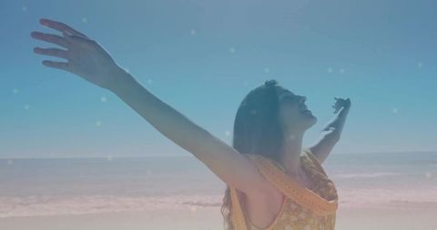 Joyful Woman Embracing Sun on Serene Seaside