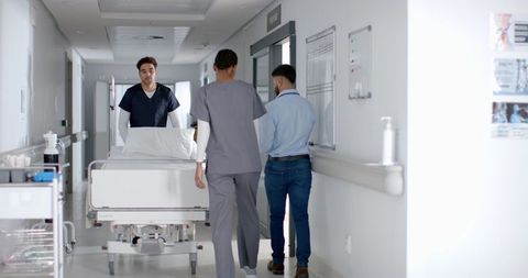 Healthcare Professionals Transport Patient in Hospital Corridor - Download Free Stock Images Pikwizard.com
