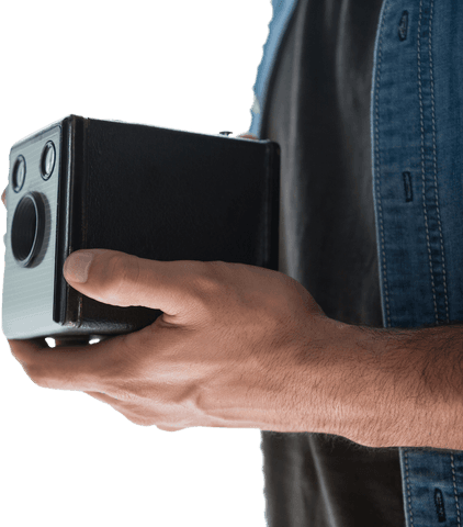 Male hand holding transparent vintage camera for retro photography