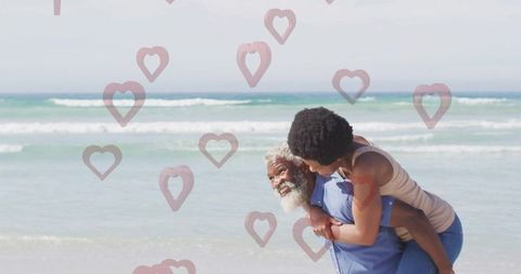 Joyful Senior Couple Piggybacking on Sunny Beach