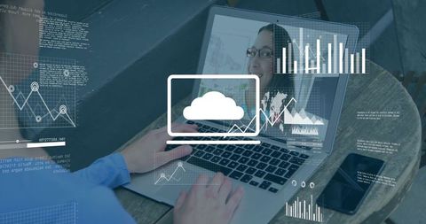 Collaborating remotely analyzing cloud analytics and charts on laptop during video call