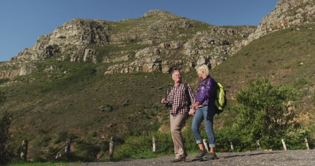 Senior Couple Hiking in Mountain Landscape on Sunny Day - Download Free Stock Images Pikwizard.com