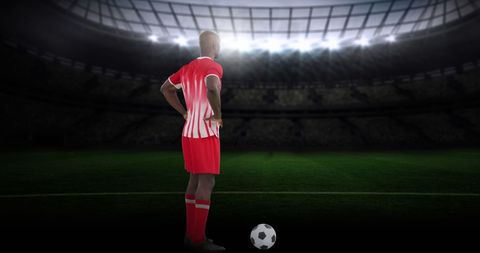 Soccer Player in Stadium Under Spotlight