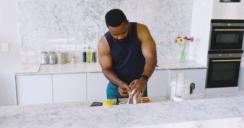 Man Grating Vegetables in Modern Kitchen for Healthy Cooking