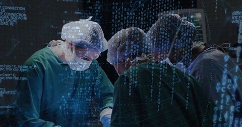 Surgical team performing operation with real-time digital data overlay and monitors