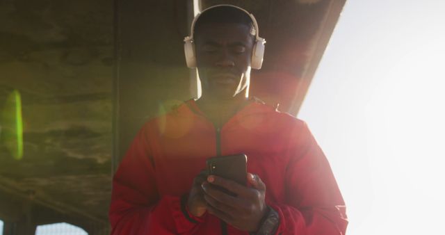 Focused African American Male Listening to Music on Smartphone - Download Free Stock Images Pikwizard.com