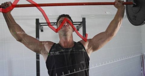 Man Weightlifting in Modern Gym with Digital Analytics Overlay