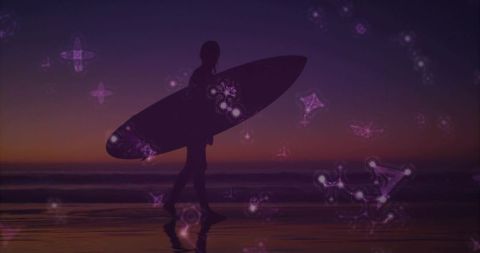 Silhouette surfer walking at twilight with celestial glow