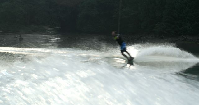 Person Wakeboarding on Lake Creating Spray - Download Free Stock Images Pikwizard.com