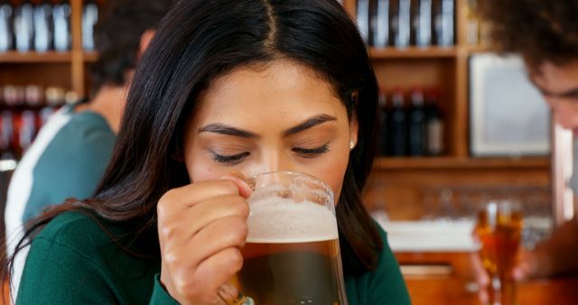 Woman Enjoying Beer at Busy Pub - Download Free Stock Images Pikwizard.com