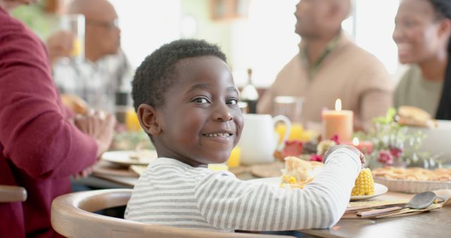 Smiling Child Enjoying Family Dinner Gathering - Download Free Stock Images Pikwizard.com