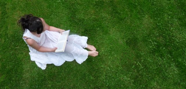 Woman Reading Book on Grass in White Dress Aerial View - Download Free Stock Images Pikwizard.com