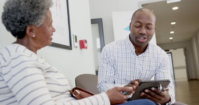 Medical Professional Consulting Elder Woman with Tablet - Download Free Stock Images Pikwizard.com