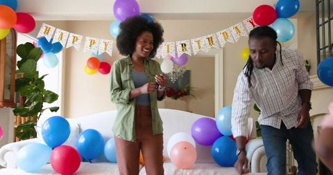 Joyful Family Decorating Home for Birthday Celebration