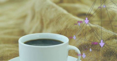 White cup holding black coffee on cozy textured fabric with purple data network overlay