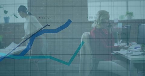 Businesswoman at Desk Analyzing Digital Data Overlay in Open-Plan Office Environment