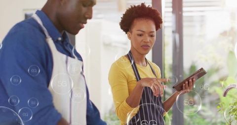 Couple Collaborating in Modern Kitchen with Technology