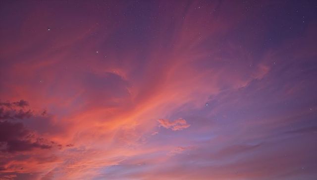 Sunset sky glowing with diagonal layered clouds, pink violet gradient and distant stars