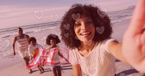 Joyful Family Selfie at Sunset Beach with Heart Overlay