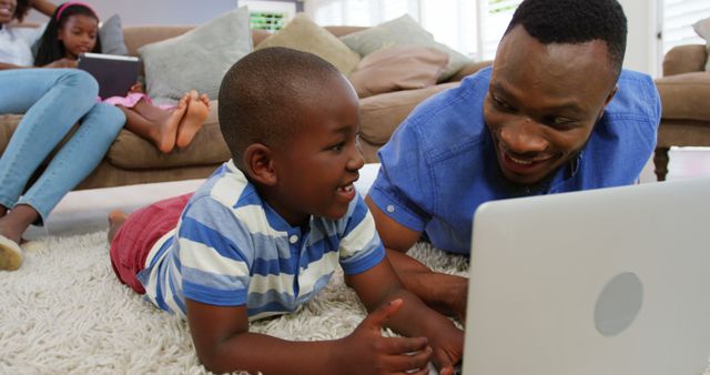 Happy African American Family Using Technology Together at Home - Download Free Stock Images Pikwizard.com