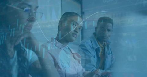 Data-Driven Team Analyzing Financial Charts in Boardroom, Professionals Collaborating