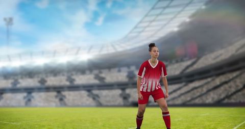 Female Soccer Player in Shining Empty Stadium