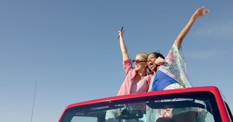 joyful friends enjoying summer road trip in red convertible - Download Free Stock Images Pikwizard.com