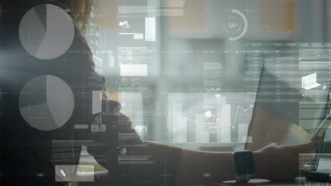 Businesswoman Analyzing Data on Laptop with Graphs and Charts Overlay