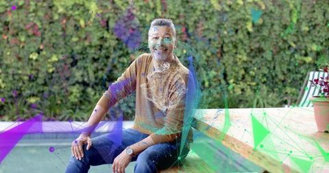 Smiling man sitting on deck by pool with holographic network overlay for tech lifestyle
