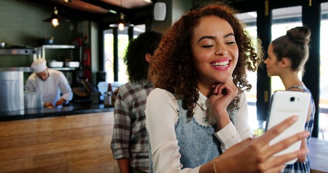 Young Woman Taking a Selfie in a Trendy Café - Download Free Stock Images Pikwizard.com