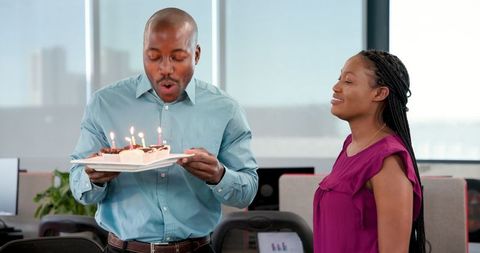African American Coworkers Celebrating Birthday in Office Environment