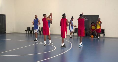 Diverse Basketball Team in Action on Indoor Court