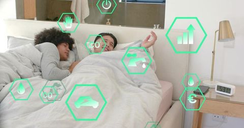 Couple sleeping and sharing duvet while smart home monitoring health and energy metrics