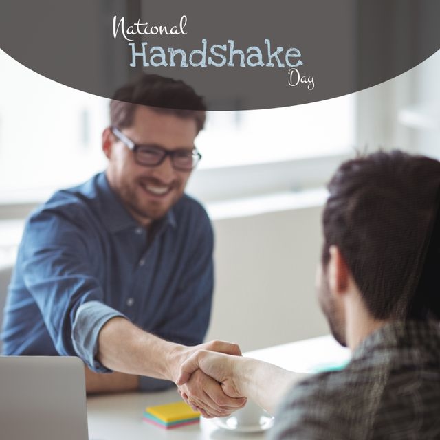 Depicts colleagues in formal setting engaging in firm handshake. Ideal image for promoting business partnerships, professional conferences, collaboration, workplace trust-building, and celebratory occasions like National Handshake Day.