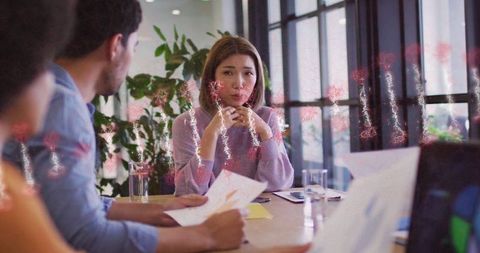 Businesswoman Leading Meeting with Data Presentation